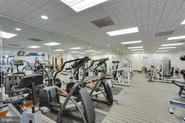 a dining room with a table and chairs