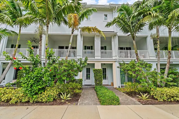 front view of a house with a garden