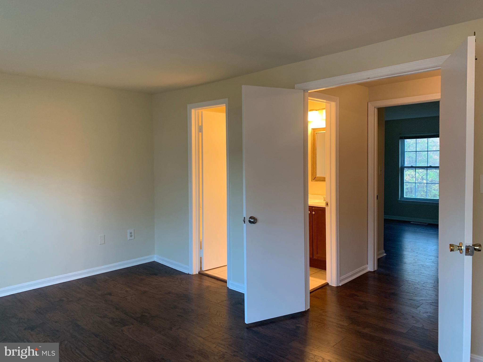 1658 Colonial Way Frederick, MD 21702 - Photo 12 of 32 an empty room with wooden floor and windows