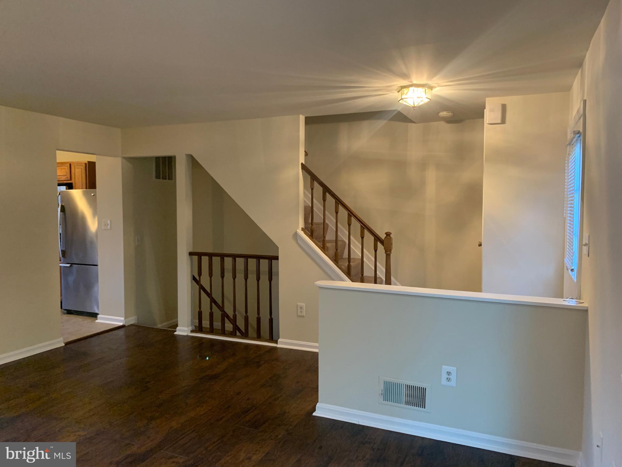 1658 Colonial Way Frederick, MD 21702 - Photo 4 of 32 a view of staircase with wooden floor and fan