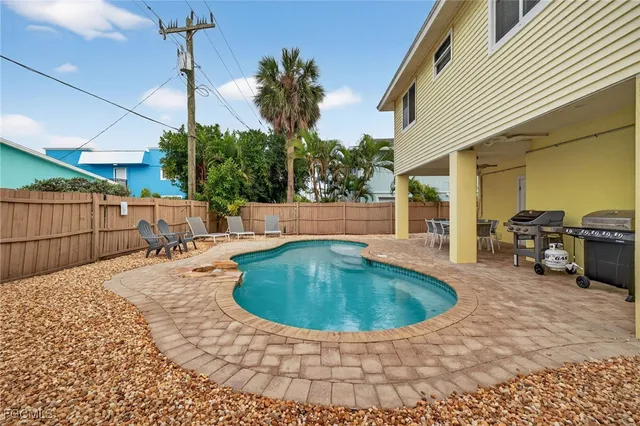 a view of a backyard with sitting area
