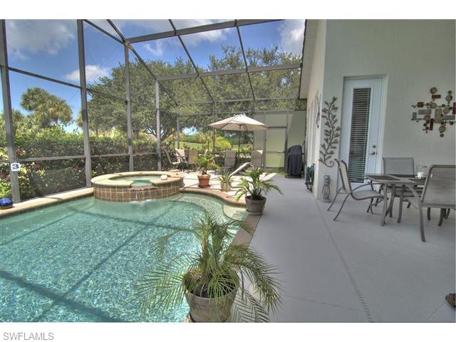 400 Harvard Court Naples, FL 34104 - Photo 15 of 16 a view of outdoor space yard deck patio and swimming pool