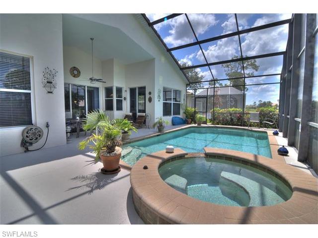 400 Harvard Court Naples, FL 34104 - Photo 16 of 16 a swimming pool with outdoor seating