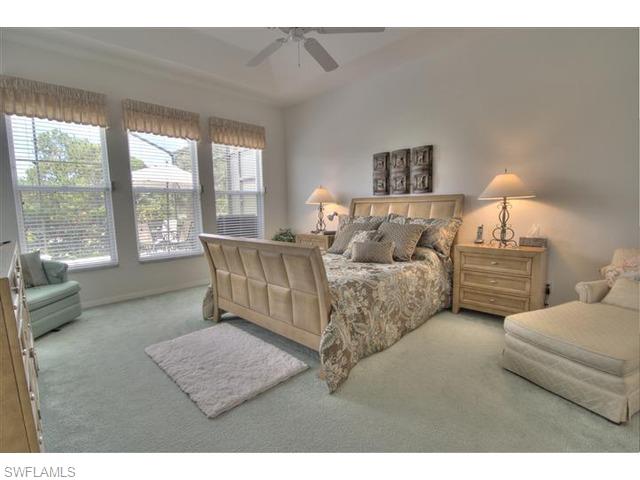400 Harvard Court Naples, FL 34104 - Photo 7 of 16 a living room with furniture and a large window