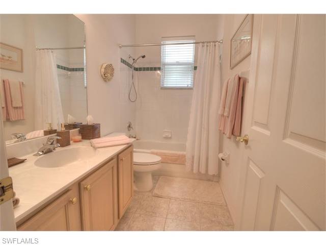 400 Harvard Court Naples, FL 34104 - Photo 10 of 16 a bathroom with a sink a toilet and shower