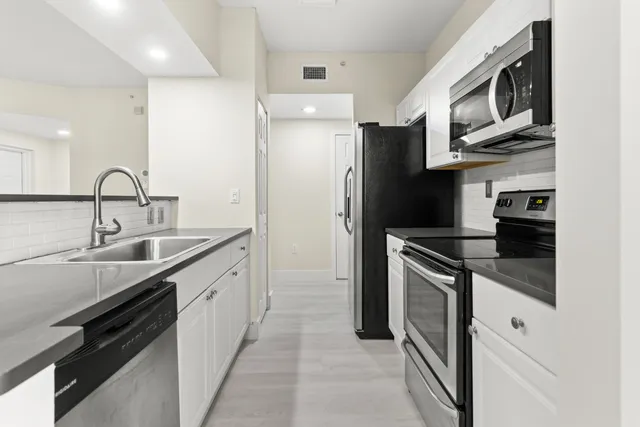 a view of a dining room with furniture and window