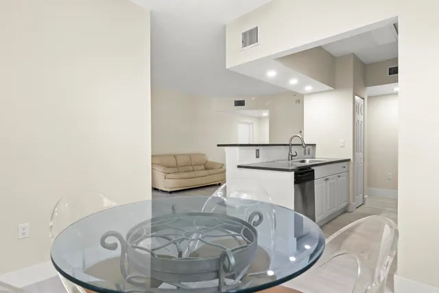 a living room with furniture and a ceiling fan