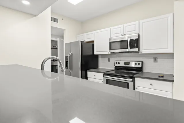 a view of a swimming pool with an outdoor seating