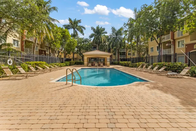 a view of a building with a yard