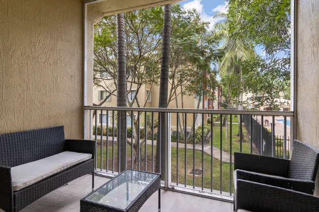 a view of a balcony with chairs