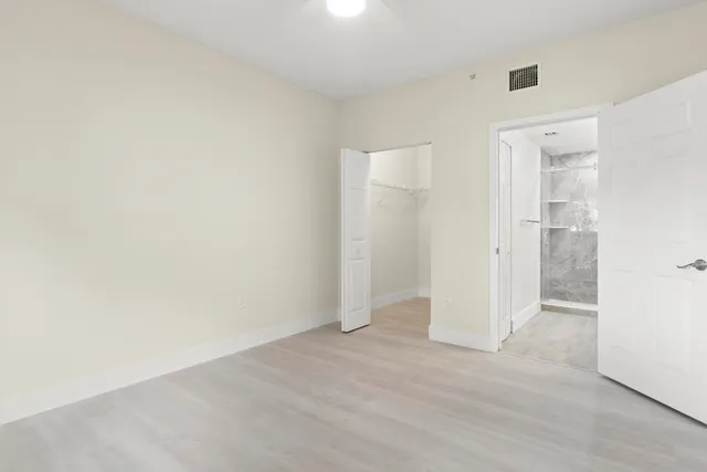 an empty room with wooden floor