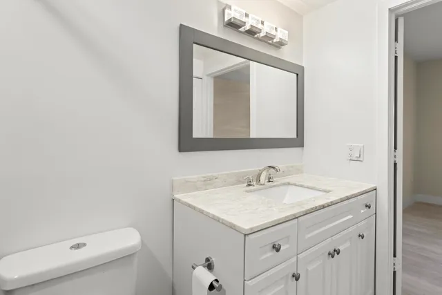 a view of a kitchen with microwave and cabinets