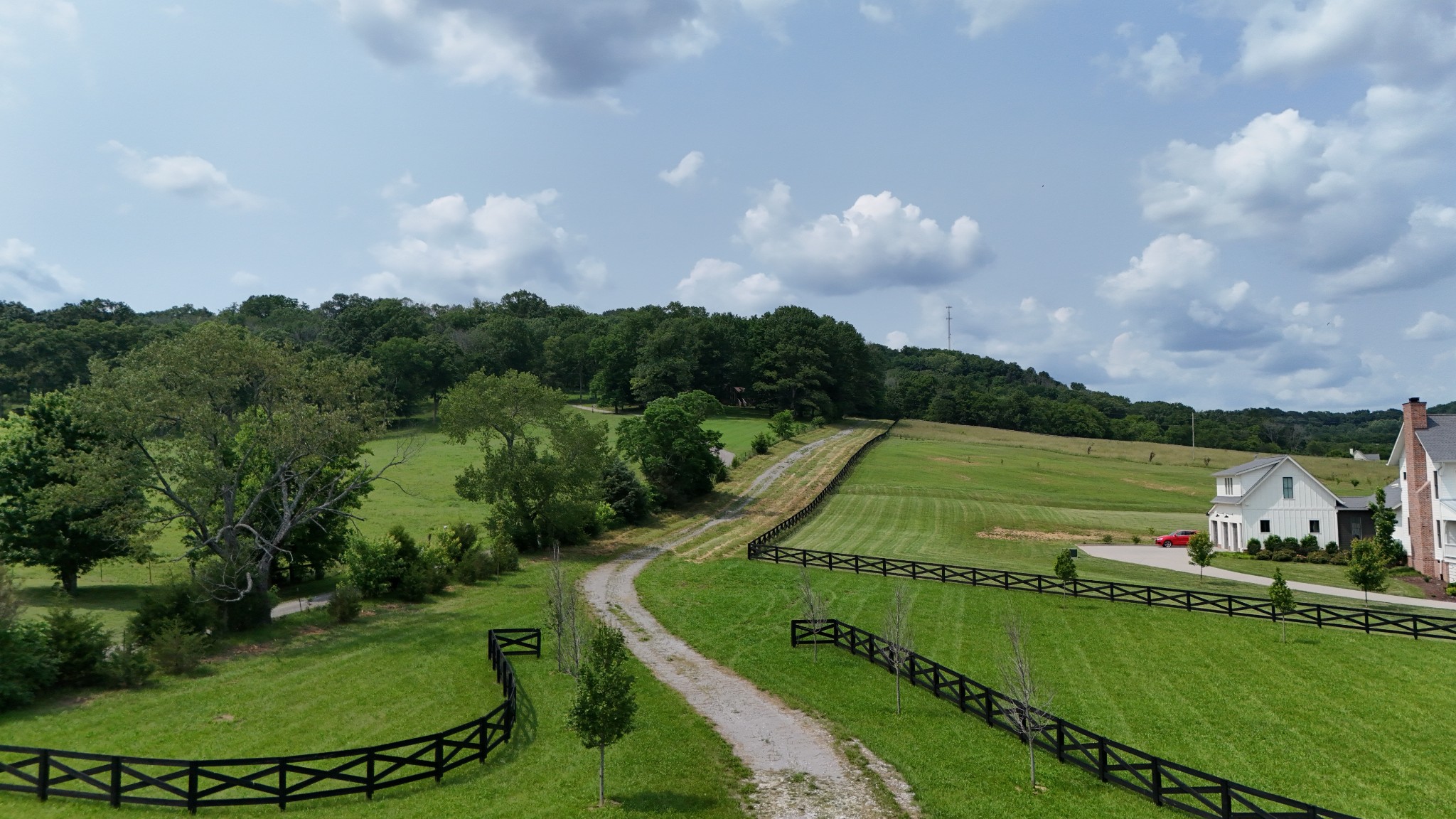 4500 Harpeth School Road Franklin, TN 37064 - Photo 4 of 8 an aerial view of a golf course with a swimming pool a fountain and a yard