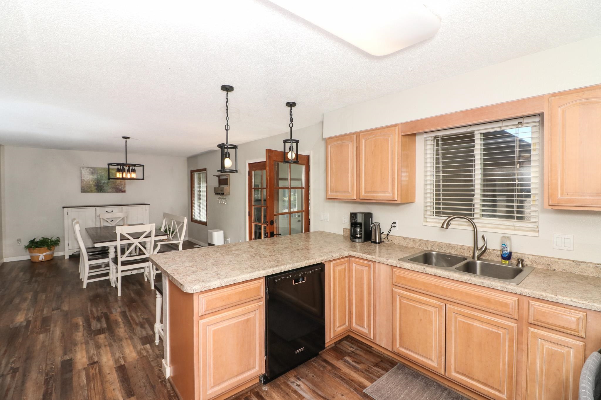 607-28 28 3/4 Road Grand Junction, CO 81506 - Photo 7 of 42 a kitchen with stainless steel appliances granite countertop a sink stove and cabinets