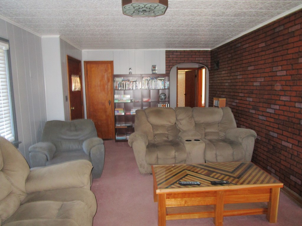 1404 Pittsburgh Road Franklin, PA 16323 - Photo 5 of 19 a living room with furniture and a fireplace