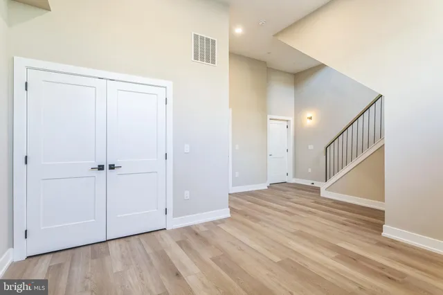 a view of an entryway with wooden floor