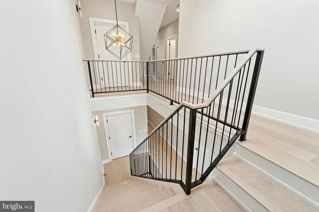 a bathroom with a sink toilet vanity and shower