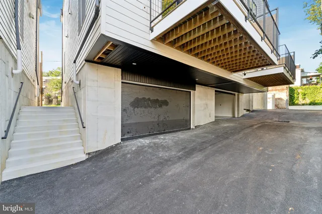 an aerial view of residential houses with city view