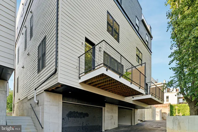 an aerial view of a house with a garden