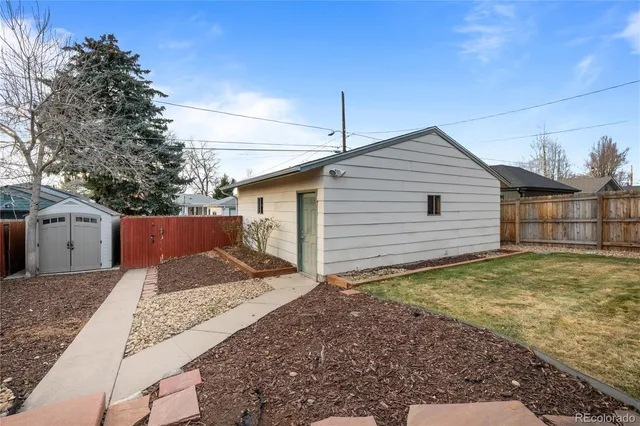a view of a backyard of the house