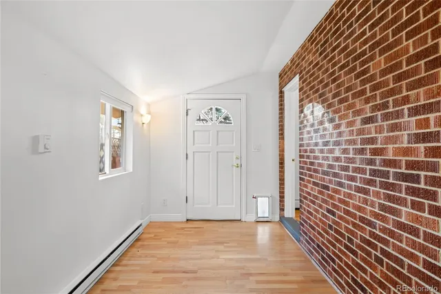 a view of a livingroom with an empty space and a window