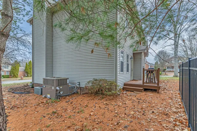 a backyard of a house with large trees
