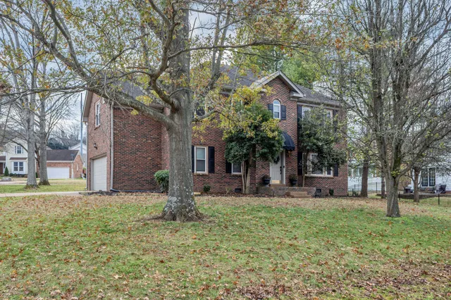 a house view with a sitting space and garden
