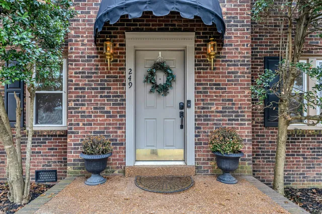 a view of a entryway of the house with potted plants