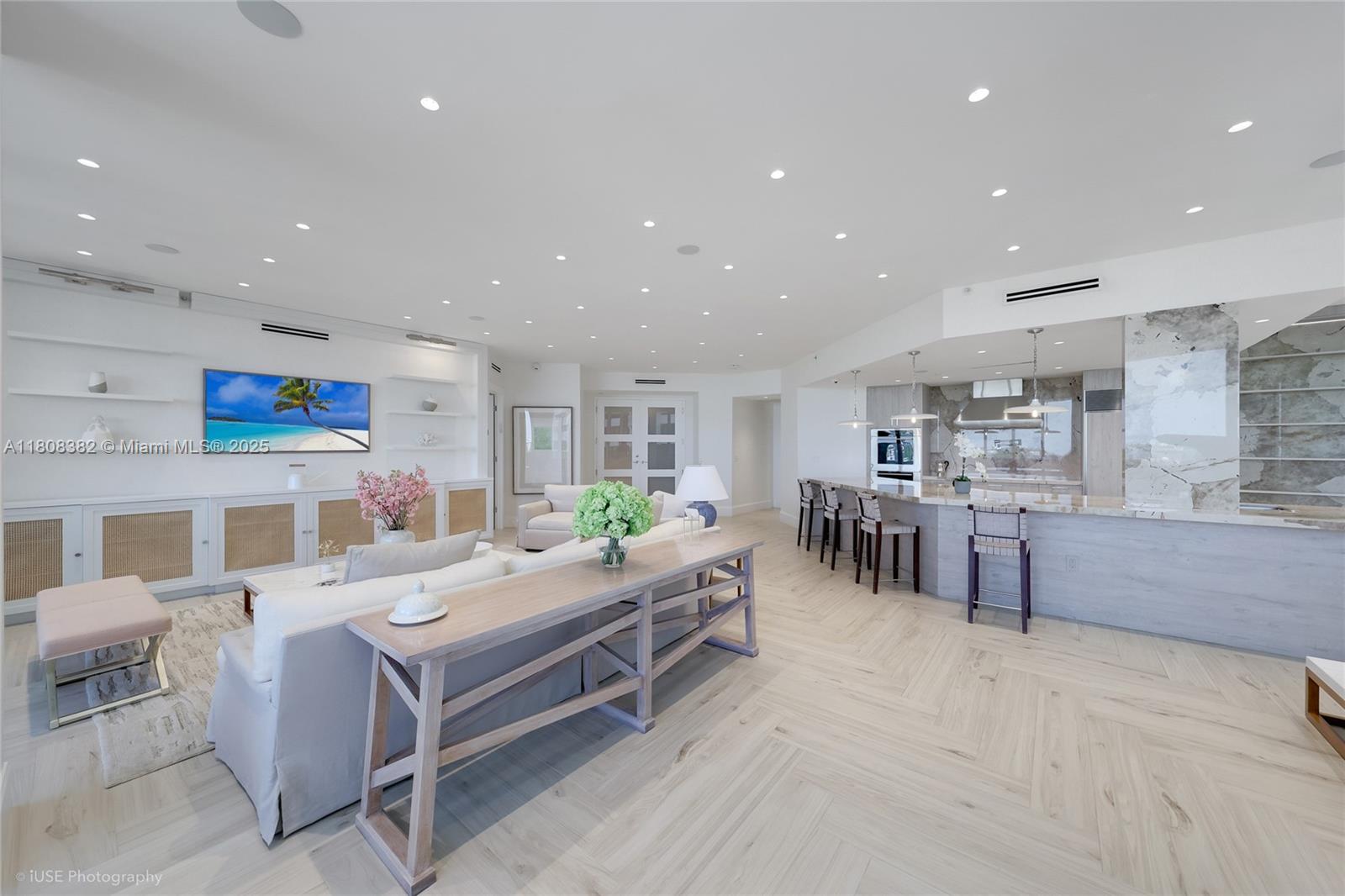 10225 Collins Avenue, Unit 604 Bal Harbour, FL 33154 - Photo 2 of 37 a kitchen with stainless steel appliances kitchen island granite countertop a sink and cabinets