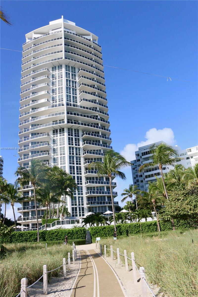 10225 Collins Avenue, Unit 604 Bal Harbour, FL 33154 - Photo 36 of 37 a front view of a building with garden