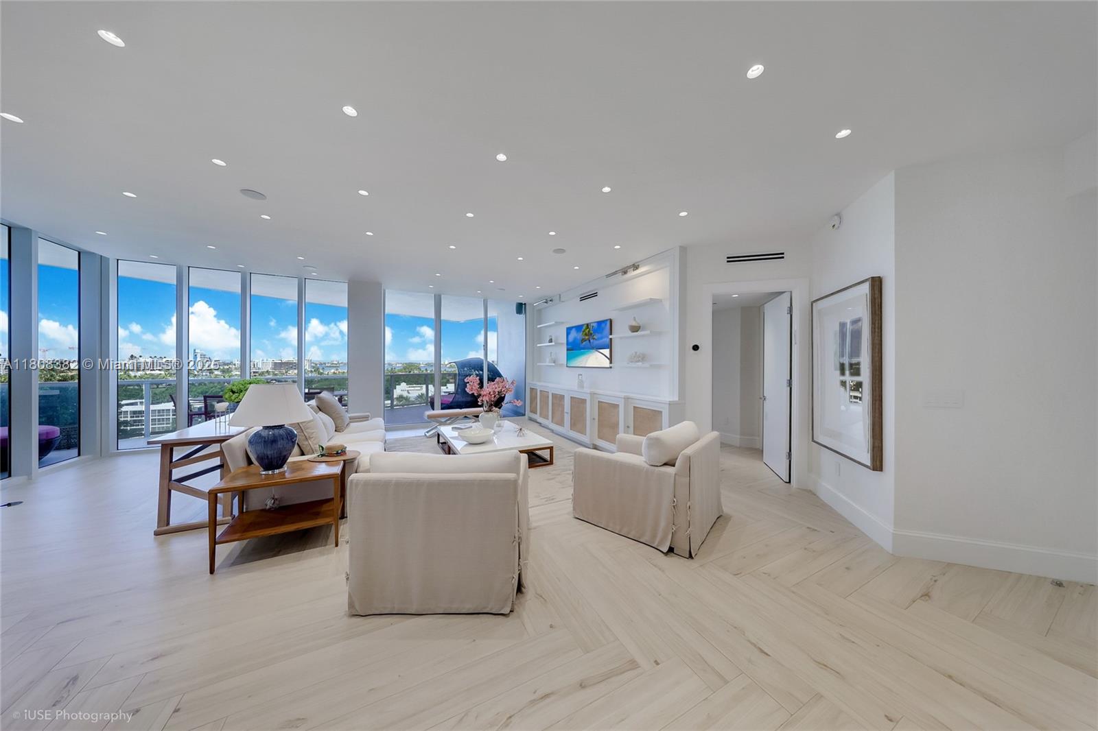 10225 Collins Avenue, Unit 604 Bal Harbour, FL 33154 - Photo 6 of 37 a living room with furniture and a large window