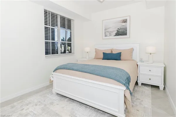 a front view of a house with a garden and outdoor seating