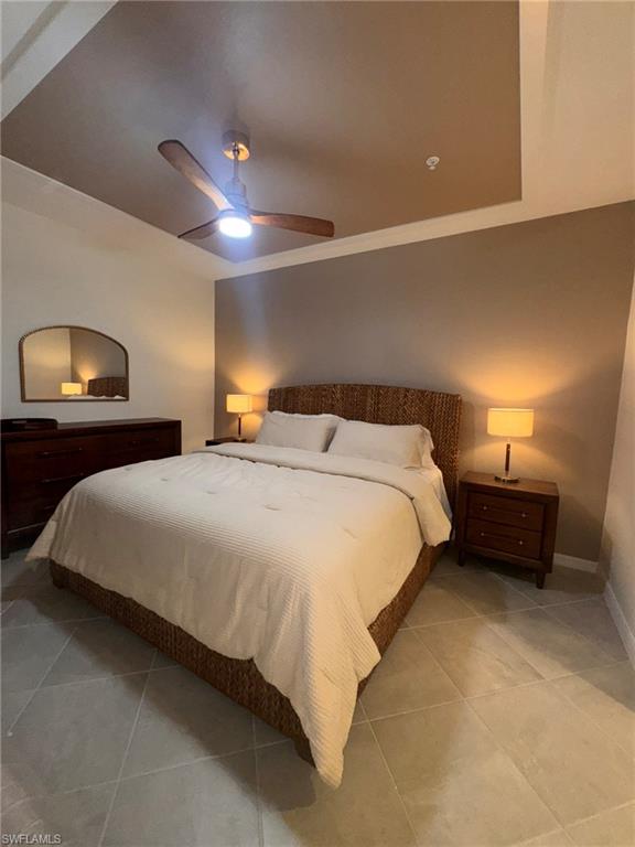 5583 Double Eagle Circle, Unit 4112 Ave Maria, FL 34142 - Photo 4 of 36 a bedroom with a bed and a lamp