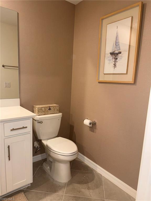 5583 Double Eagle Circle, Unit 4112 Ave Maria, FL 34142 - Photo 6 of 36 a white toilet sitting next to a white sink and vanity