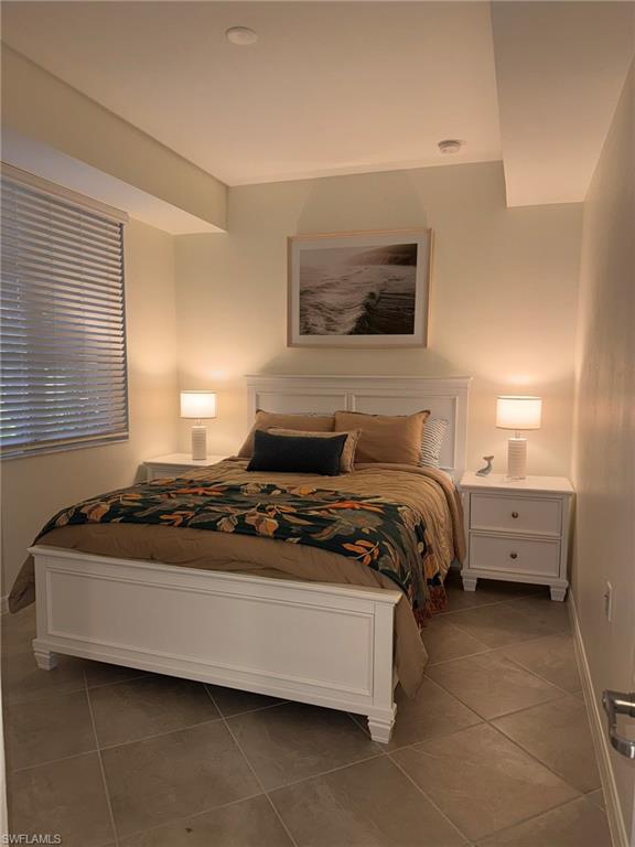 5583 Double Eagle Circle, Unit 4112 Ave Maria, FL 34142 - Photo 7 of 36 a bedroom with a bed and window