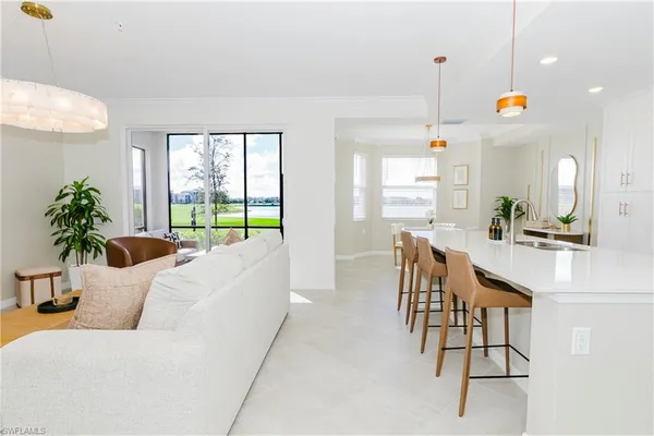 a bedroom with a bed and painting on the wall