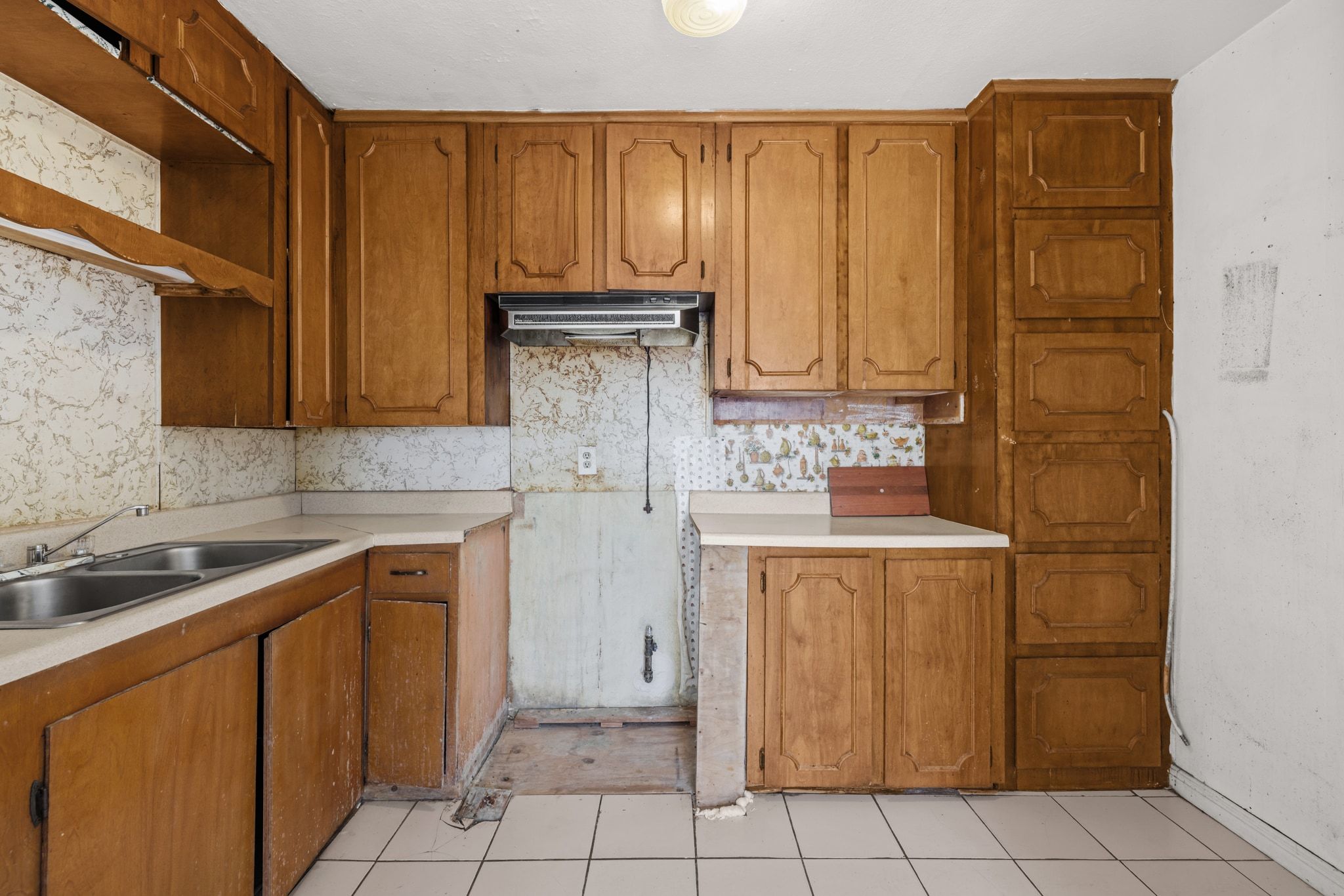 1114 Richardine Avenue Austin, TX 78721 - Photo 12 of 27 a kitchen with a sink and cabinets