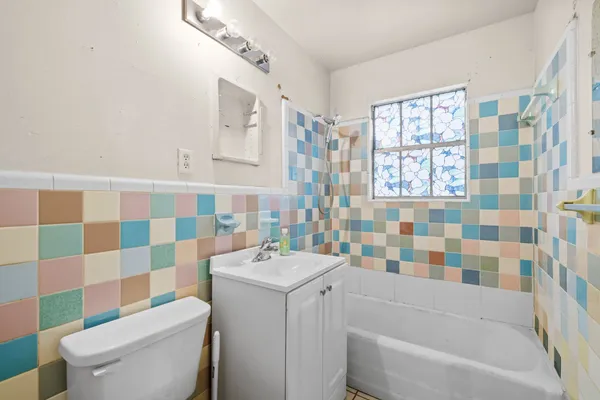 a bathroom with a sink a toilet and a bathtub