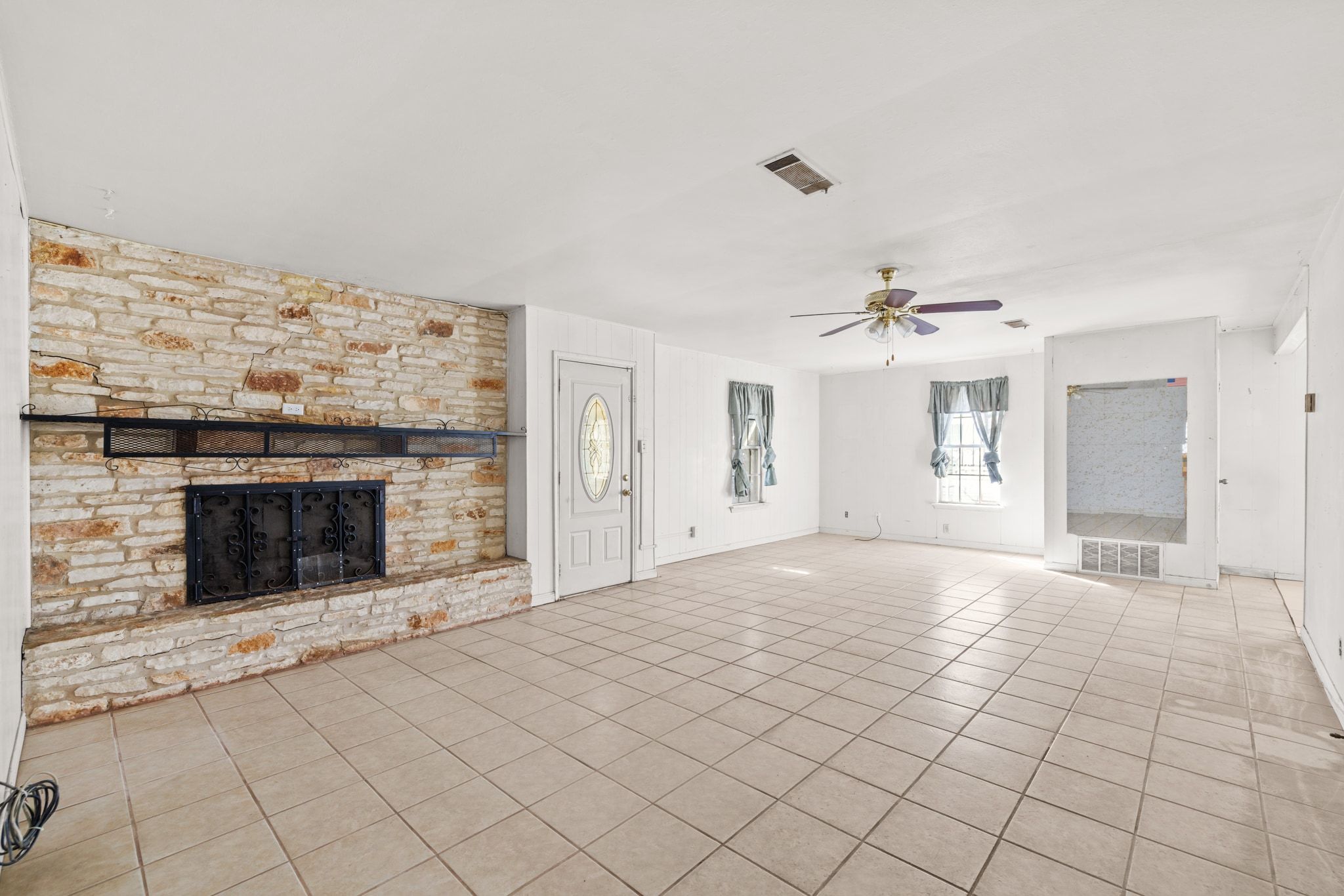 1114 Richardine Avenue Austin, TX 78721 - Photo 8 of 27 a view of a livingroom with an empty space and a fireplace