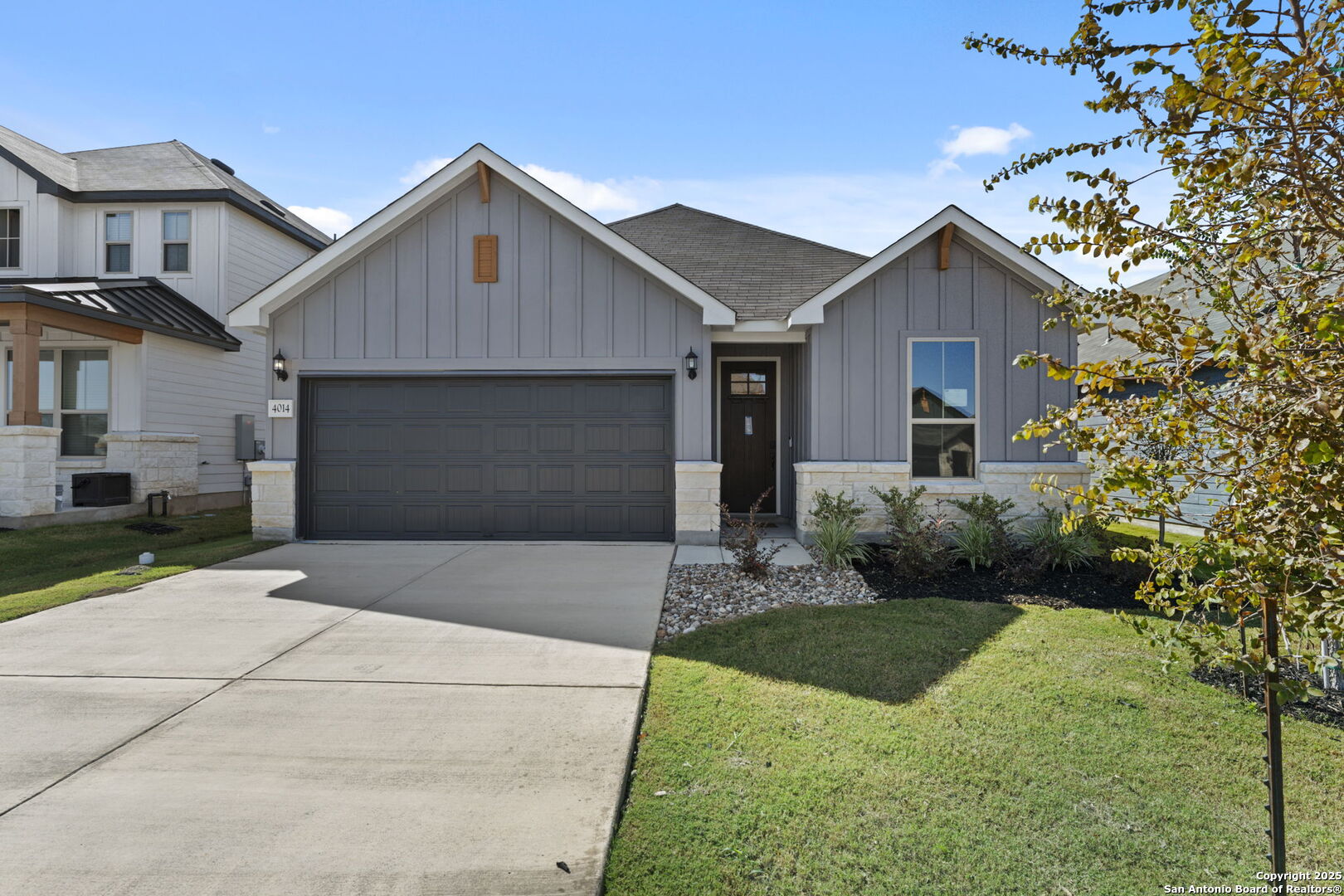 4014 Paddock Trail Seguin, TX 78155 - Photo 1 of 27 a front view of a house with a yard and garage