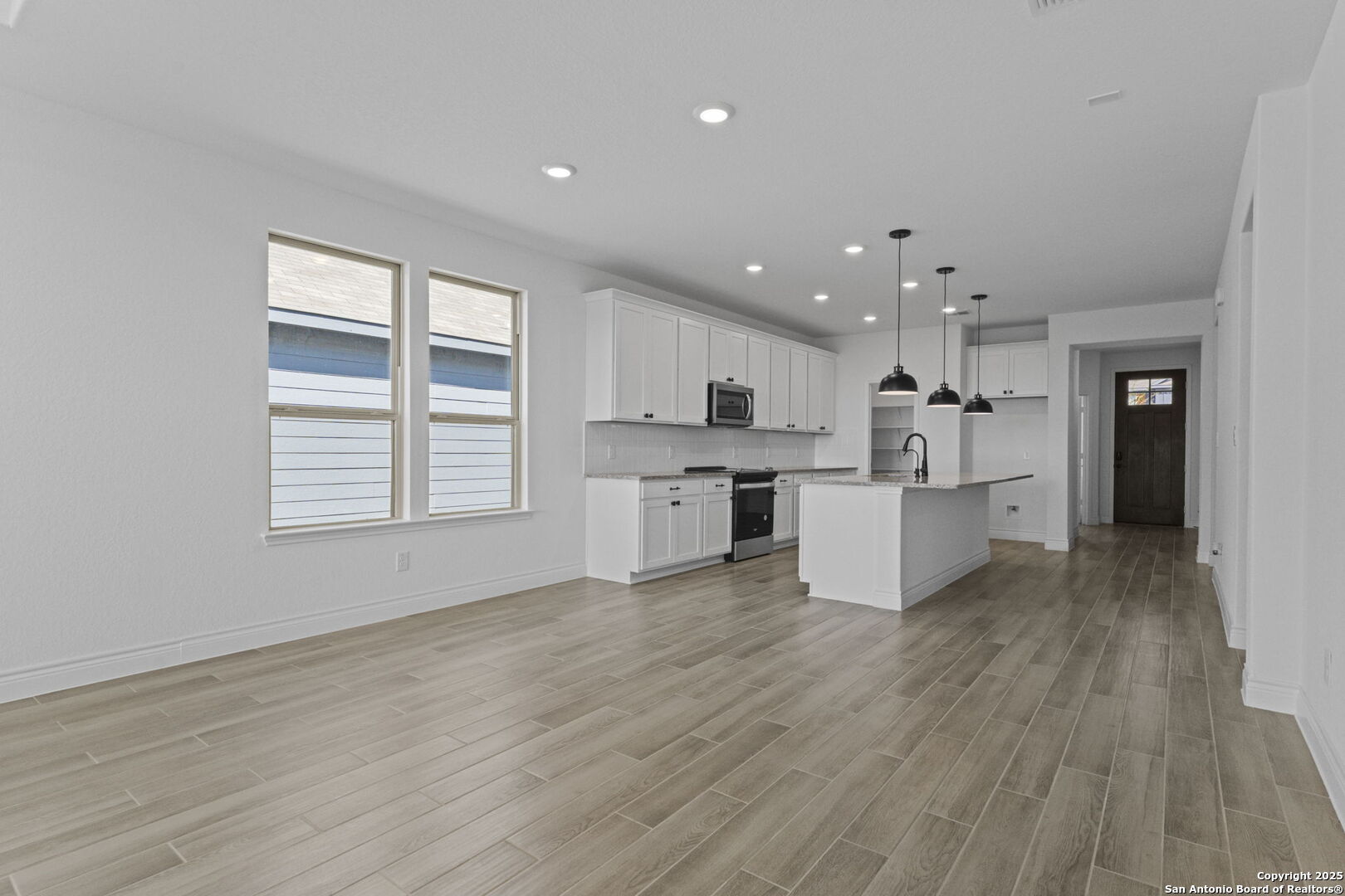 4014 Paddock Trail Seguin, TX 78155 - Photo 12 of 27 a view of kitchen with wooden floor and electronic appliances