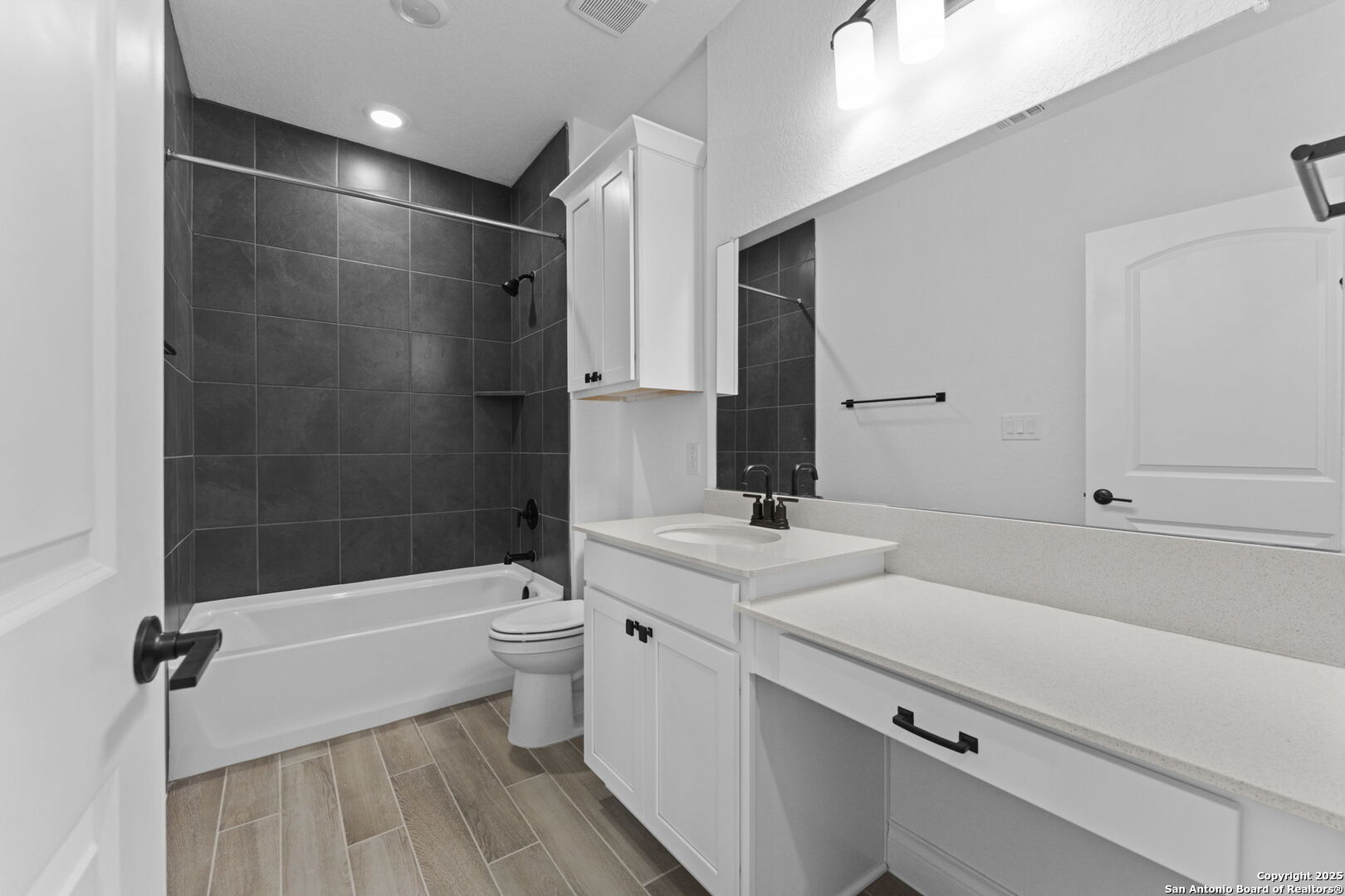 4014 Paddock Trail Seguin, TX 78155 - Photo 16 of 27 a bathroom with a sink a toilet and shower