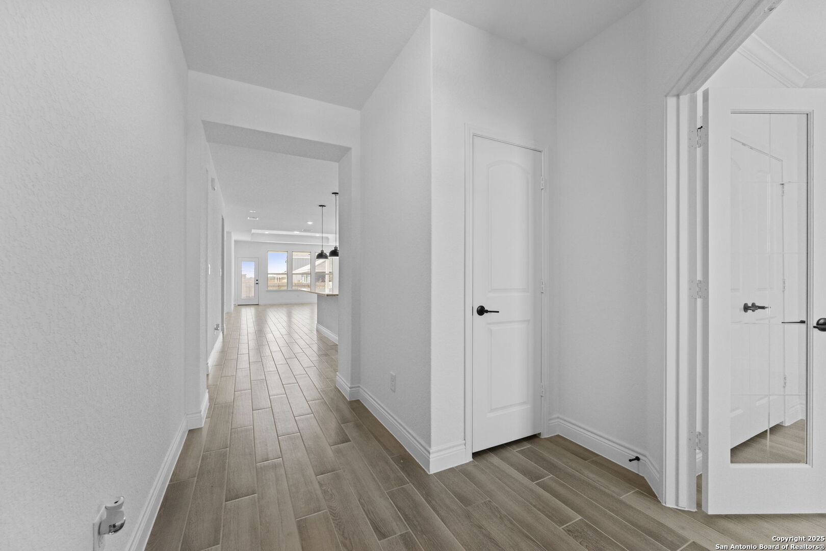 4014 Paddock Trail Seguin, TX 78155 - Photo 2 of 27 a view of a hallway with wooden floor
