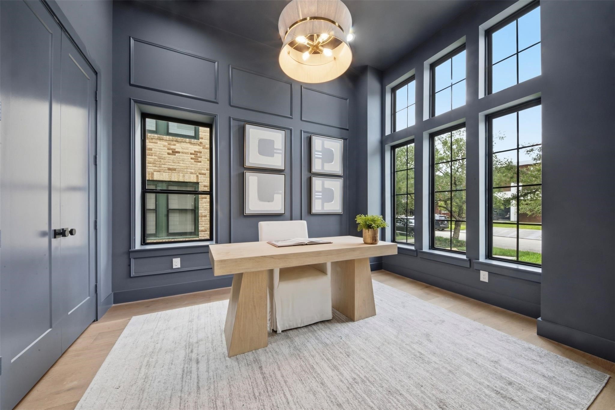 2325 Wroxton Road Houston, TX 77005 - Photo 6 of 34 First floor office with 12 foot ceilings, large closet ,custom millwork and extensive window with fill the room with light and views of the beautiful treelined street