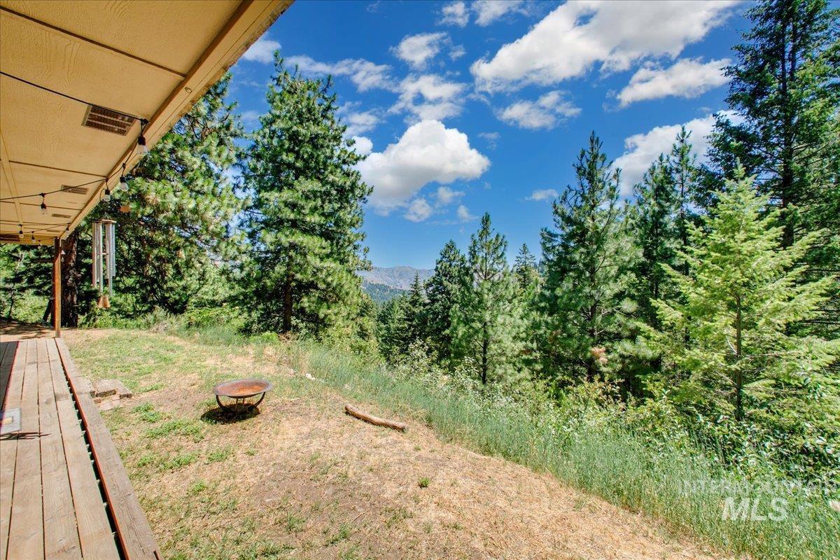 221 Tollgate Road Boise, ID 83716 - Photo 3 of 32 View of yard featuring an outdoor fire pit and a mountain view