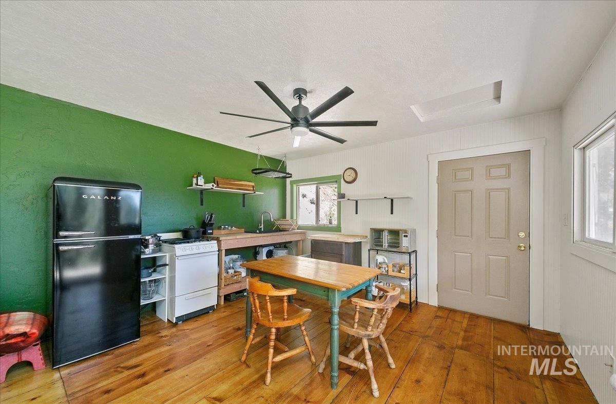 221 Tollgate Road Boise, ID 83716 - Photo 5 of 32 Dining area featuring light wood-type flooring and ceiling fan