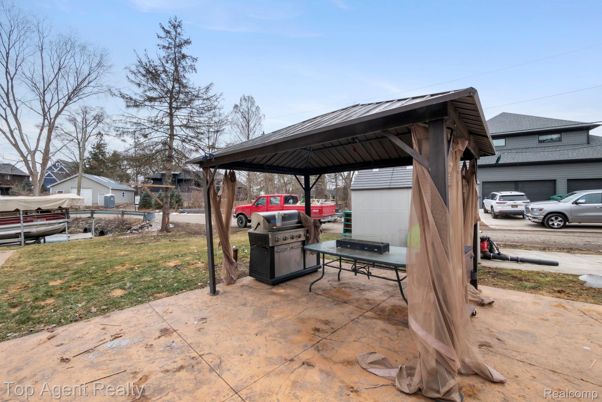 2065 Ridgemont Street Commerce Township, MI 48382 - Photo 30 of 35 View of patio featuring a gazebo, area for grilling, and a residential view