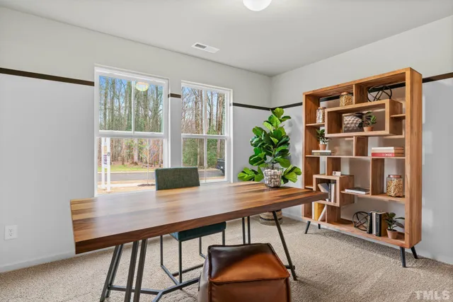a workspace with furniture and window