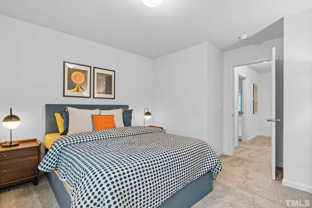 a bedroom with bed and a couch