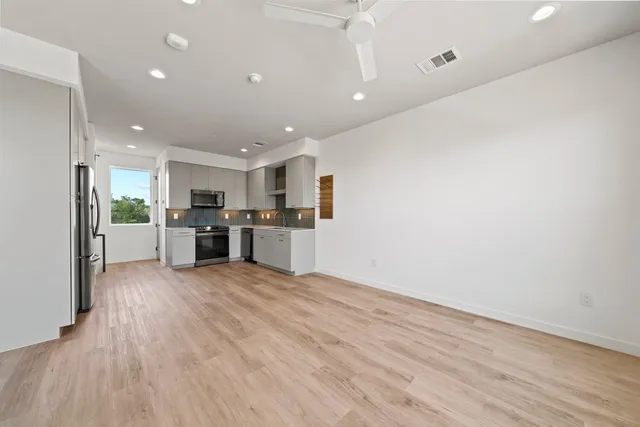 a view of kitchen with wooden floor